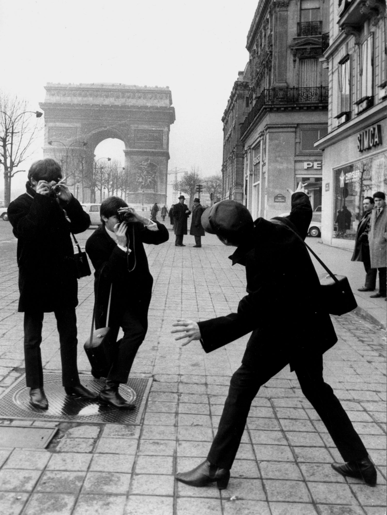The Beatles in Paris : John Lennon Photographed By George Harrison and Paul McCartney on Champs Elysees in Paris January 15, 1964 by bridgeman Images on GIANT ART - black and white photography
