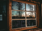 Grainy Sunset Reflection on Log Cabin Window by RJ Byrd on GIANT ART - blue photo illustration